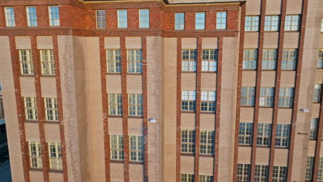 close-up view of a tall brick building's facade