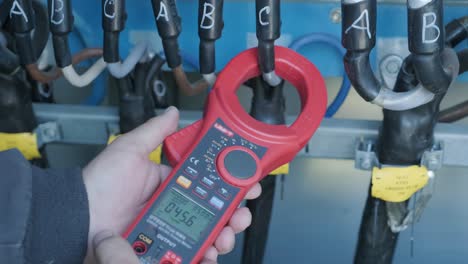 checking the operating voltage levels of the solar panel switchgear compartment