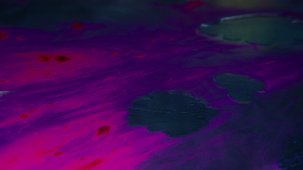 Colourful, organic, liquids macro shots buzzing and flowing