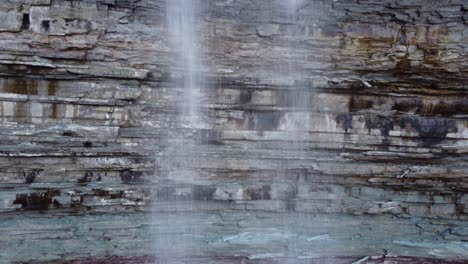 devil's punch bowl ribbon waterfall on niagara escarpment in hamilton, ontario, canada - close up descending long length shot