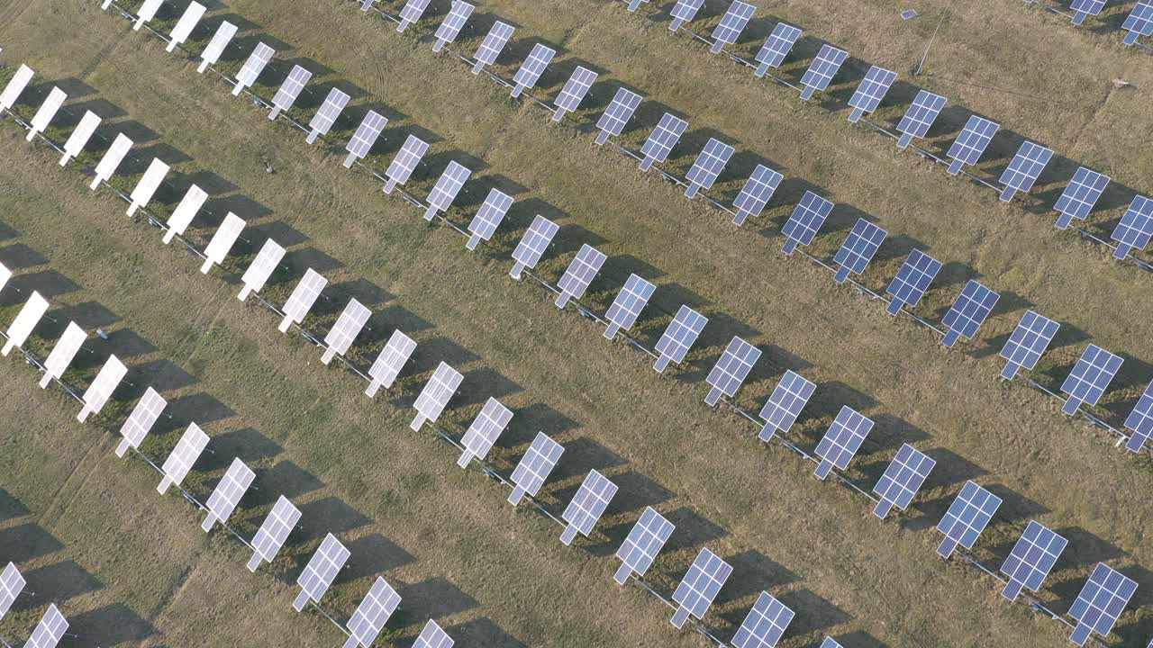 Aerial view of Solar Panels Farm. Drone flight fly over solar panels field renewable green alternative energy concept. Lithuania