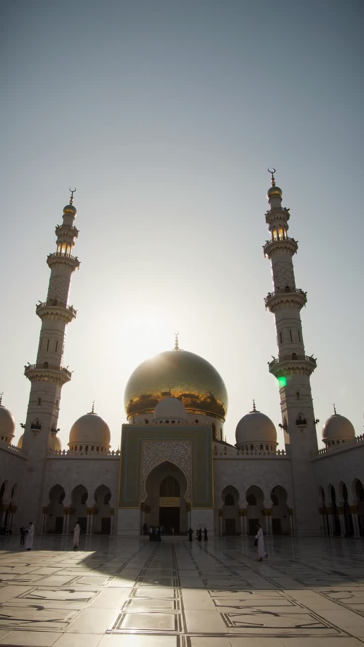 Low-angle video shot of a grand mosque at sunset, highlighting its ...