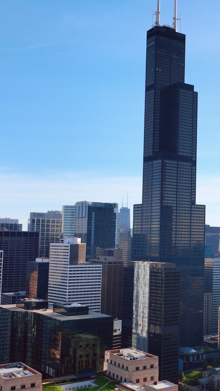 Chicago, Illinois, USA - June 01, 2024: Willis Tower originally Sears Tower towering above Chicago skyline. Aerial view. Vertical video