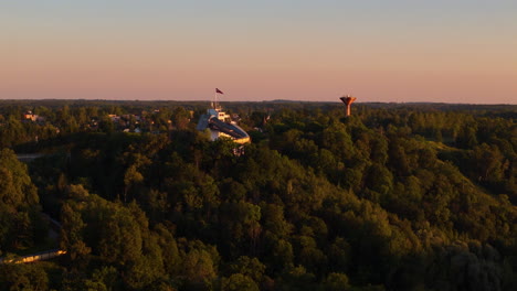 sigulda travel, tours, and adventures. aerial sunset view over the luge track in sigulda, latvia.