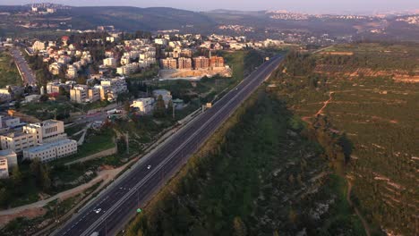 aerial view of a highway and cityscape in a valley
