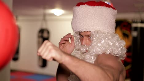 santa claus in boxing gloves trains in the ring santa claus in boxing gloves trains in the ring the concept of the new year
