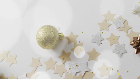 animation of white spots over christmas decorations