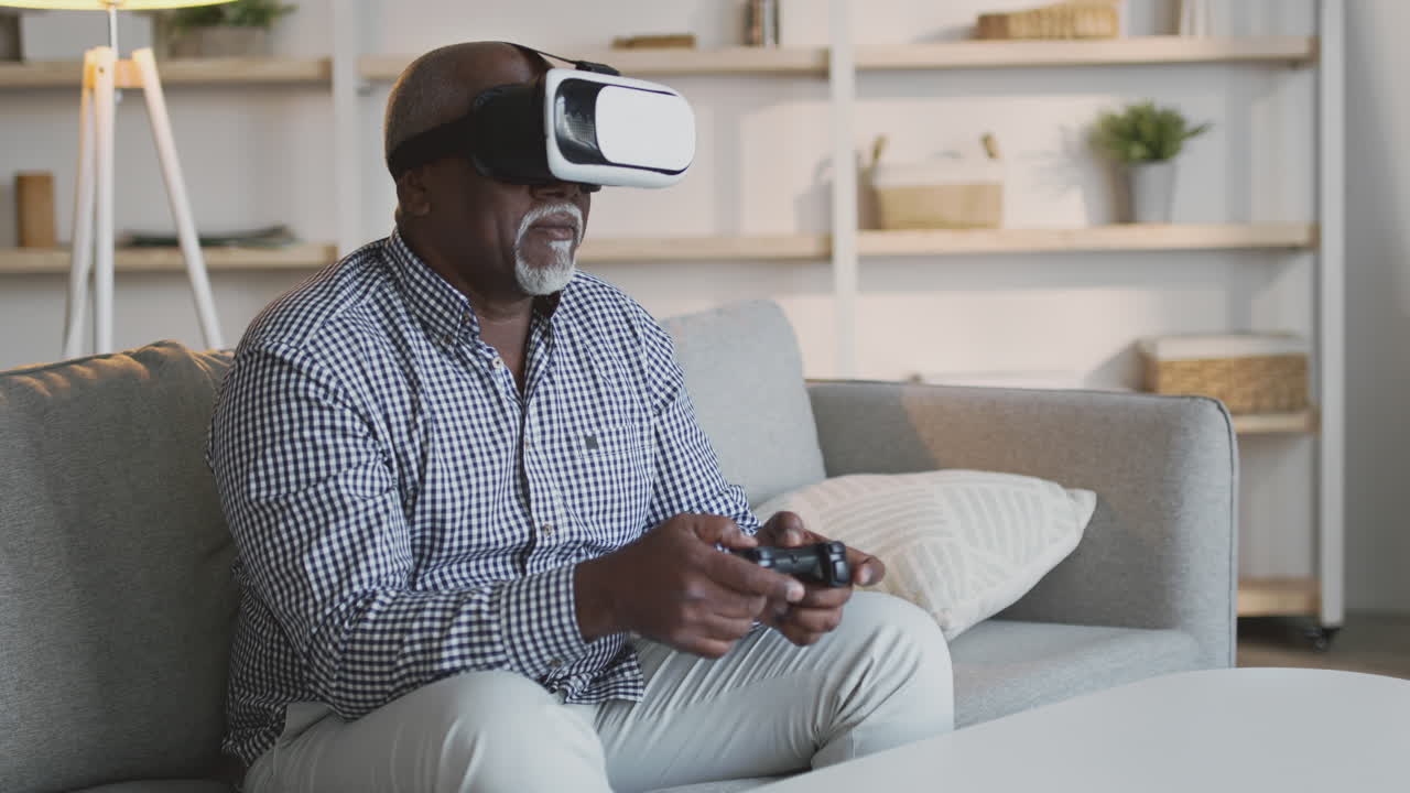 Senior Man Playing VR Game at Home