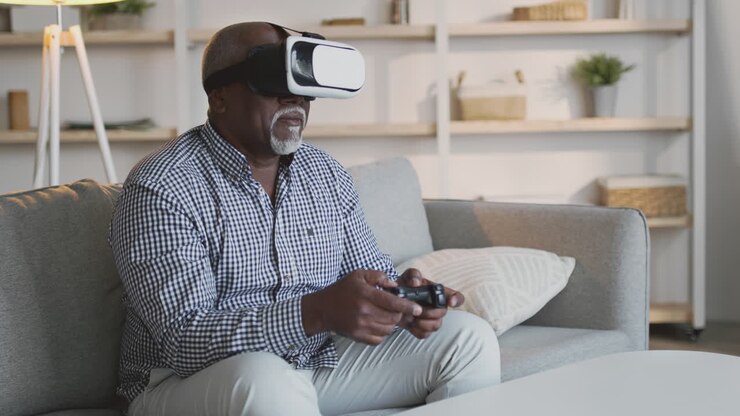 Senior Man Playing VR Game at Home