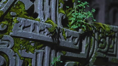 detailed closeup of an old weathered gravestone cross