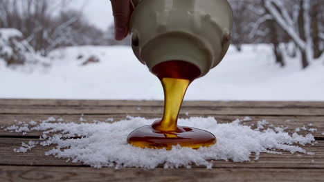 maple syrup pouring on snow