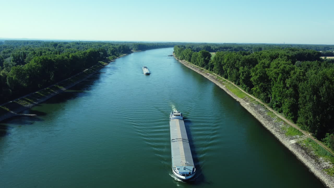 Canal with Barges and Lush Green Banks