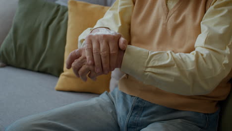 elderly man experiencing hand and wrist pain