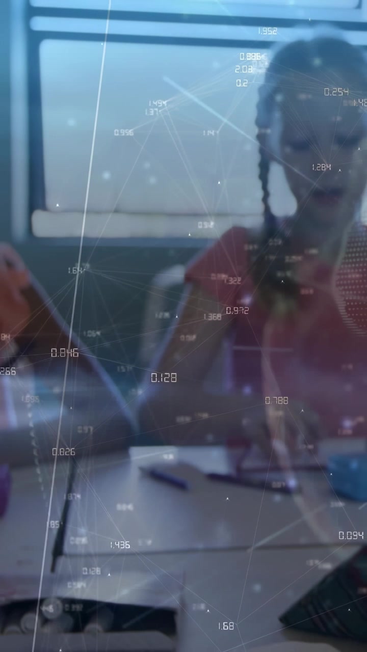 Vertical video: Braided girl reaching and folding paper for class, data overlay drifting over hands