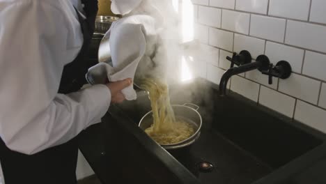 chef wringing the pasta