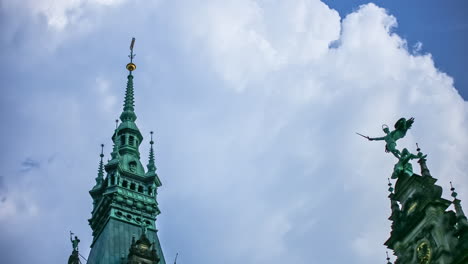 View-of-movement-of-clouds-over-the-medieval-gothic-towers,-a-popluar-tourist-destination-in-Hamburg,Germany-in-timelapse