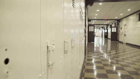 brown lockers at a high school wait out the summer for new students