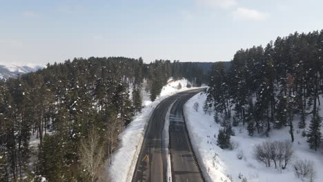 snowy highway in forest