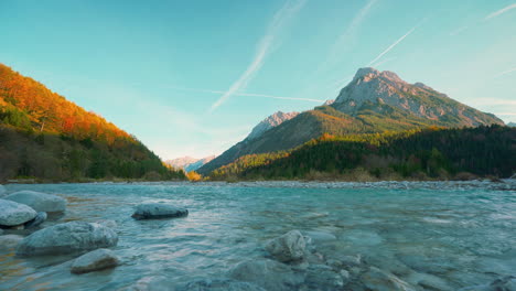 Mountain-river-in-Austria-alps-with-vibrant-autumn-sky