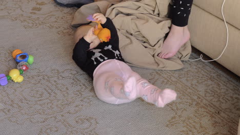 playful baby sister and serious elder brother at home