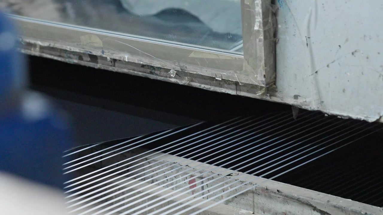 Close Up Shot Of A Animal Hide Being Processed During Production On A Industrial Leather Machine.