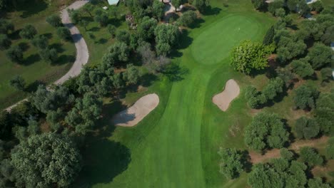 aerial view of golf course with sand bunkers