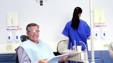 Patient-admiring-his-new-smile-in-the-mirror