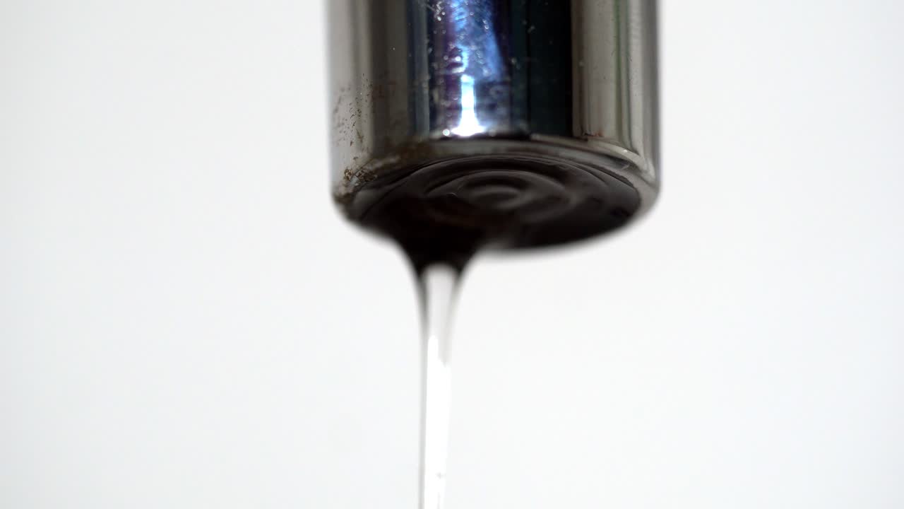 Close-up of a dripping faucet