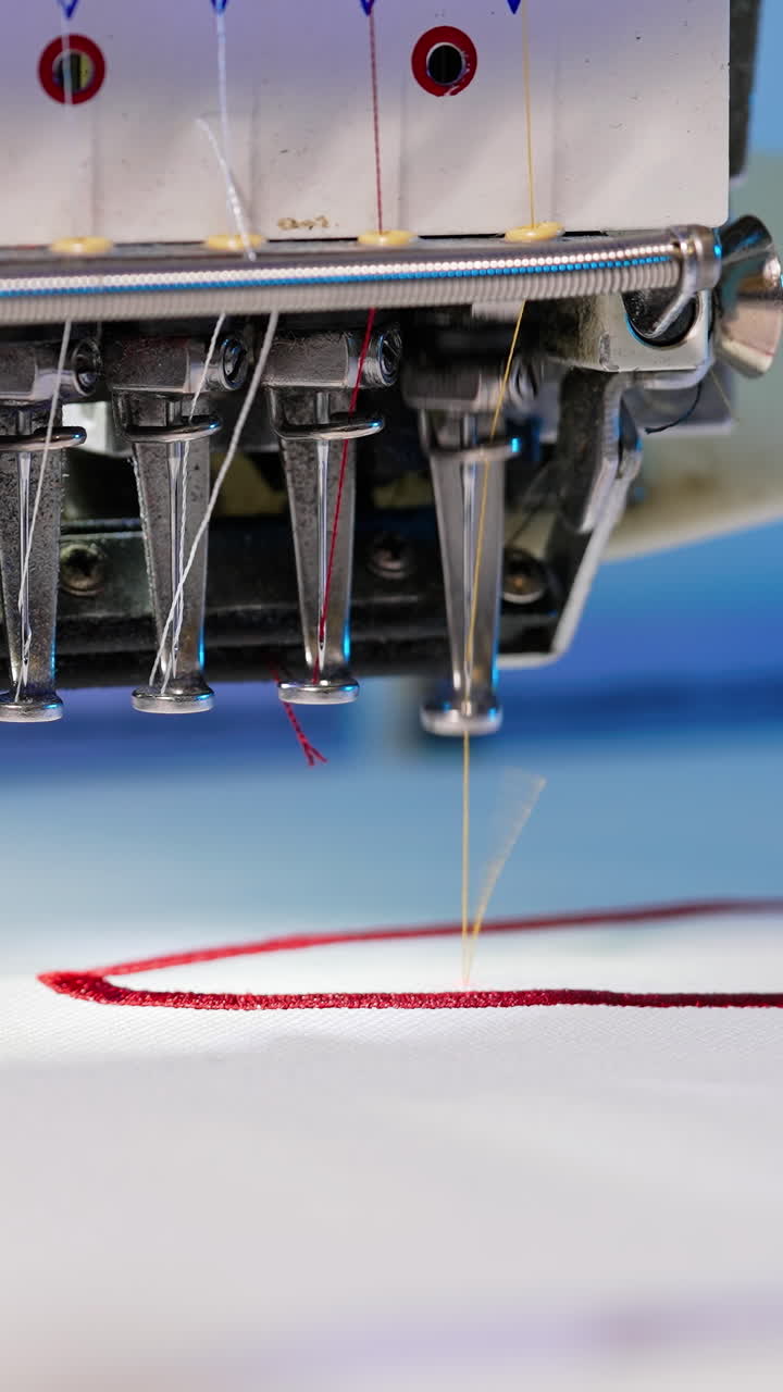 Automatic embroidery machine is working. Sewing machine needle in ...