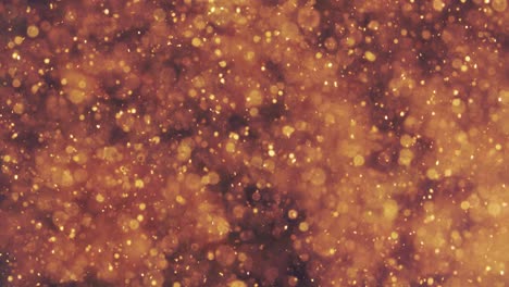 partículas doradas abstractas con borroso desfocado bokeh se mueve caos, copos de nieve