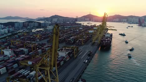 dramatic sunset over a bustling container port with cranes and ships, showcasing the importance of maritime trade and industrial activity