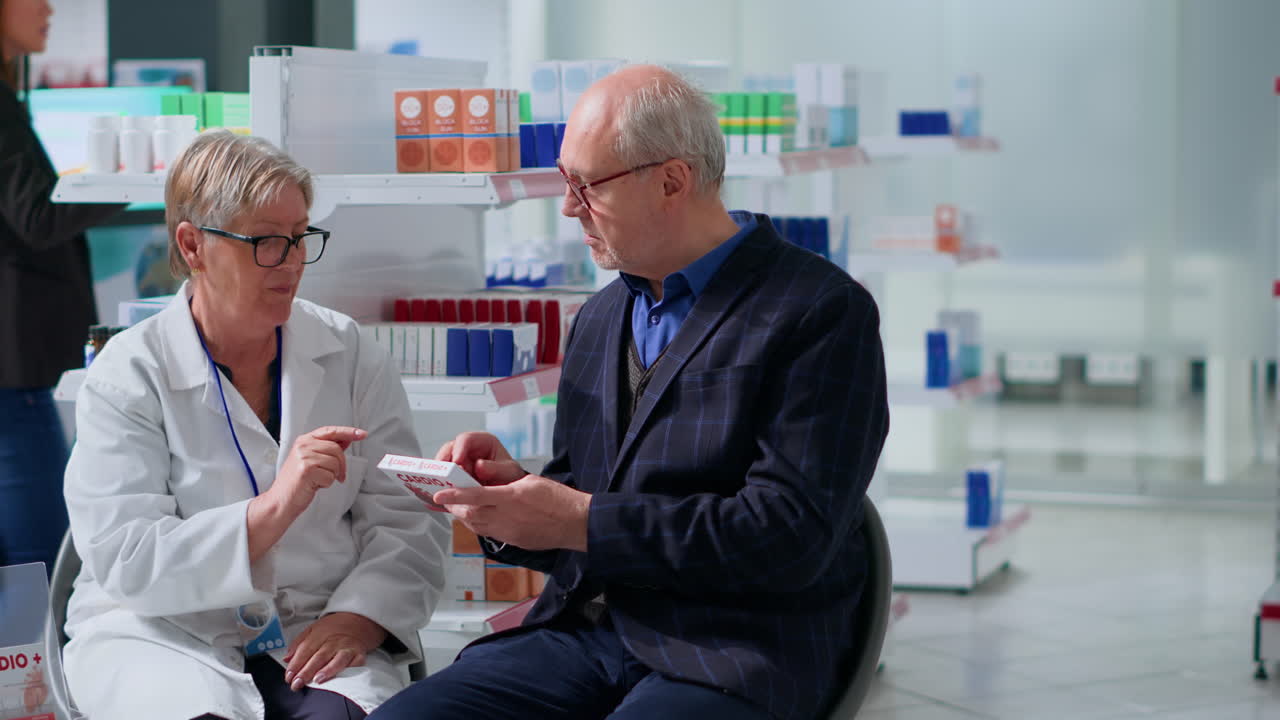 Pharmacist offering heart medication