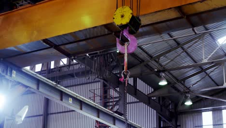 Hoist-machine-hanging-in-workshop-4k