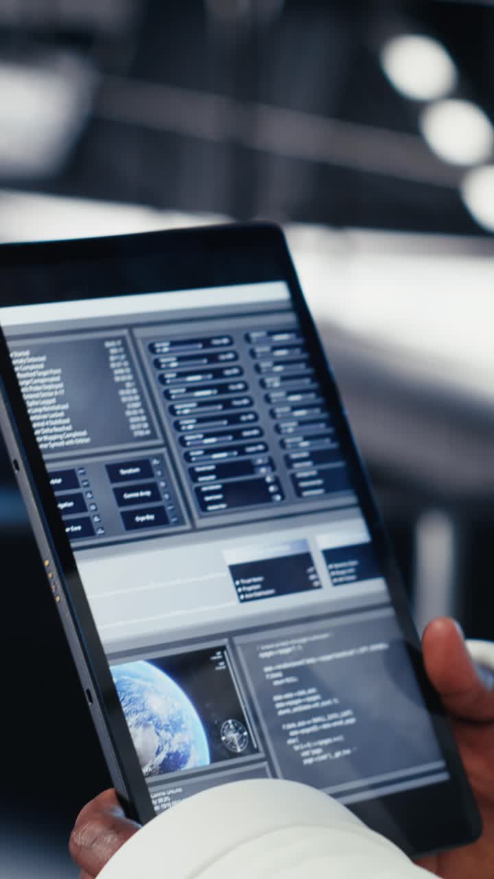 Vertical video Failed mission alert blinking over space helmet next to laptop in spacecraft