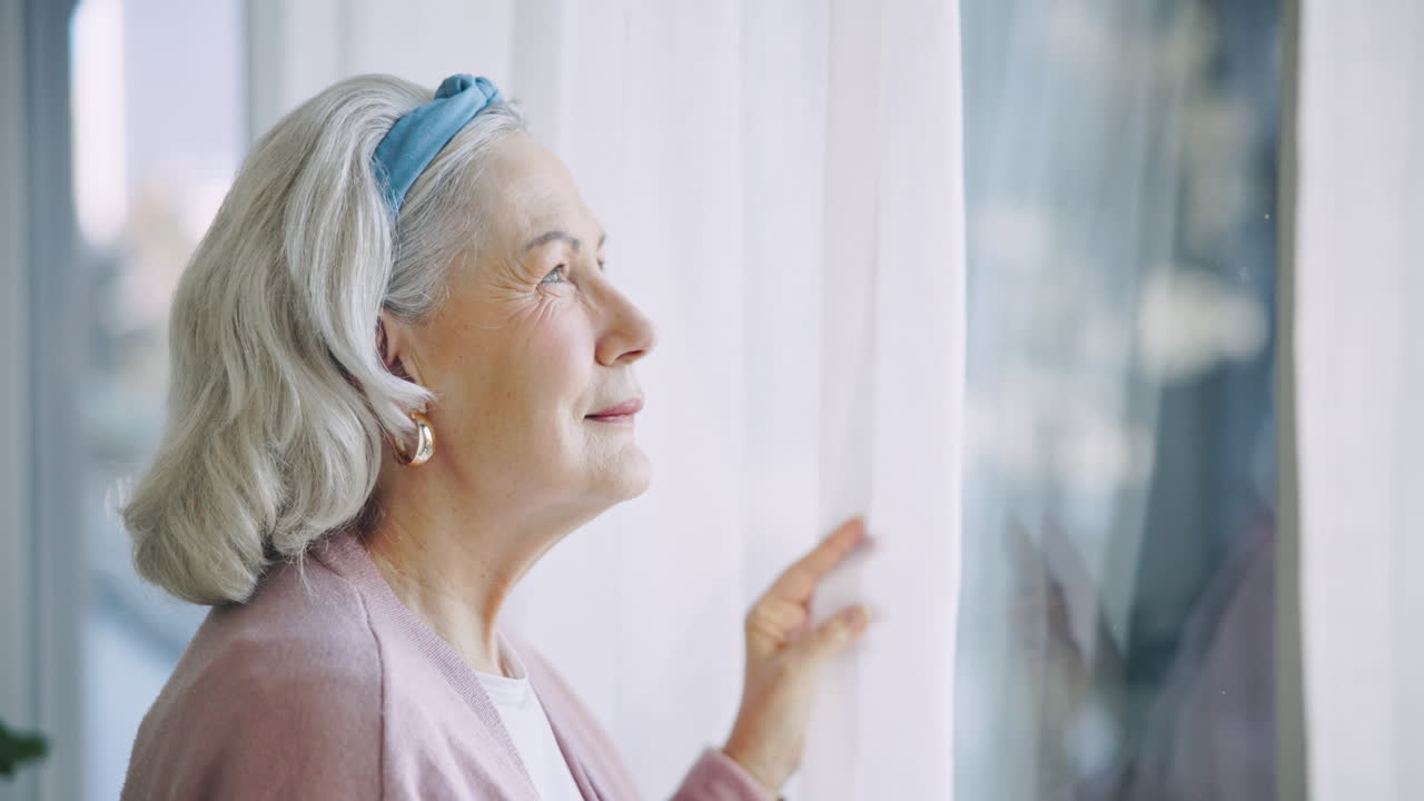 Thinking, senior and woman by window in home