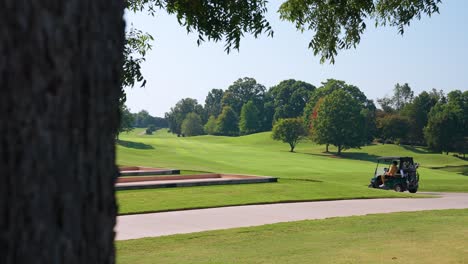 camera truck right revealing golfers driving on golf course