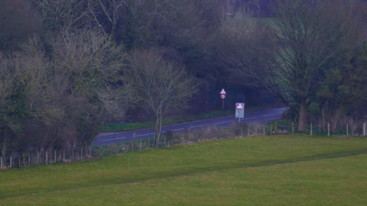 Aerial view of a foggy road between trees in the city of Dover, England