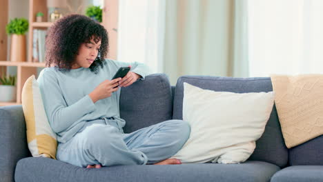 Relaxed-woman-texting-on-a-phone-while-being-lazy