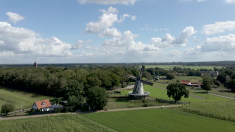 fast aerial jib up of traditional windmill in rural area