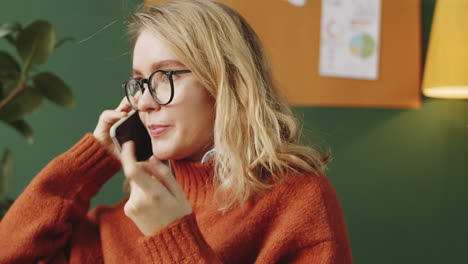 woman on a phone call in the office