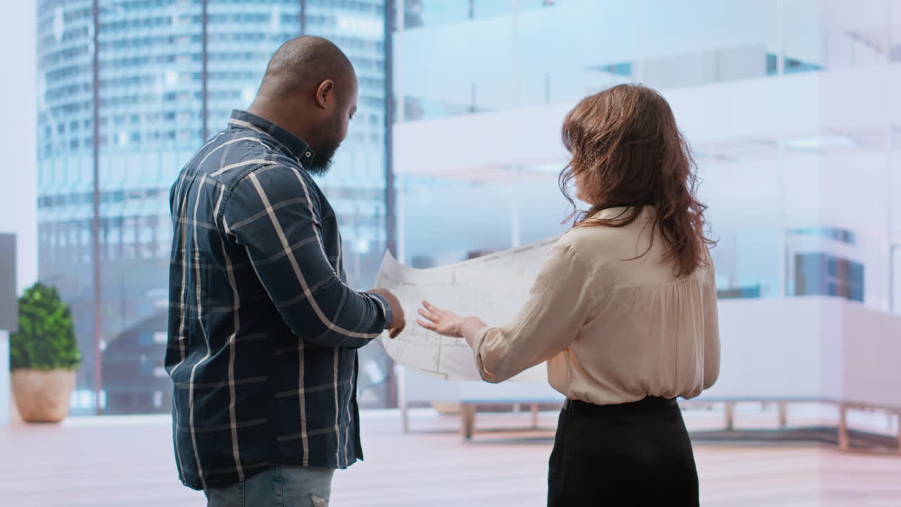 Business managers meeting with a realtor for a real estate office tour