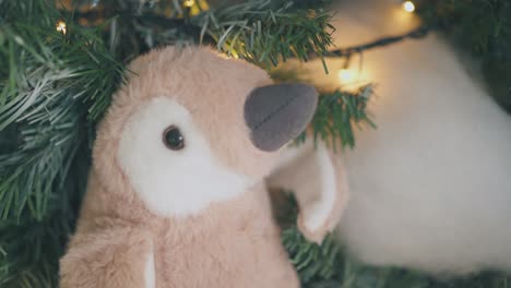 toy-penguin-used-as-decoration-on-Christmas-tree-close-view