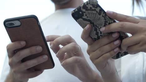 cropped shot of people using smartphones