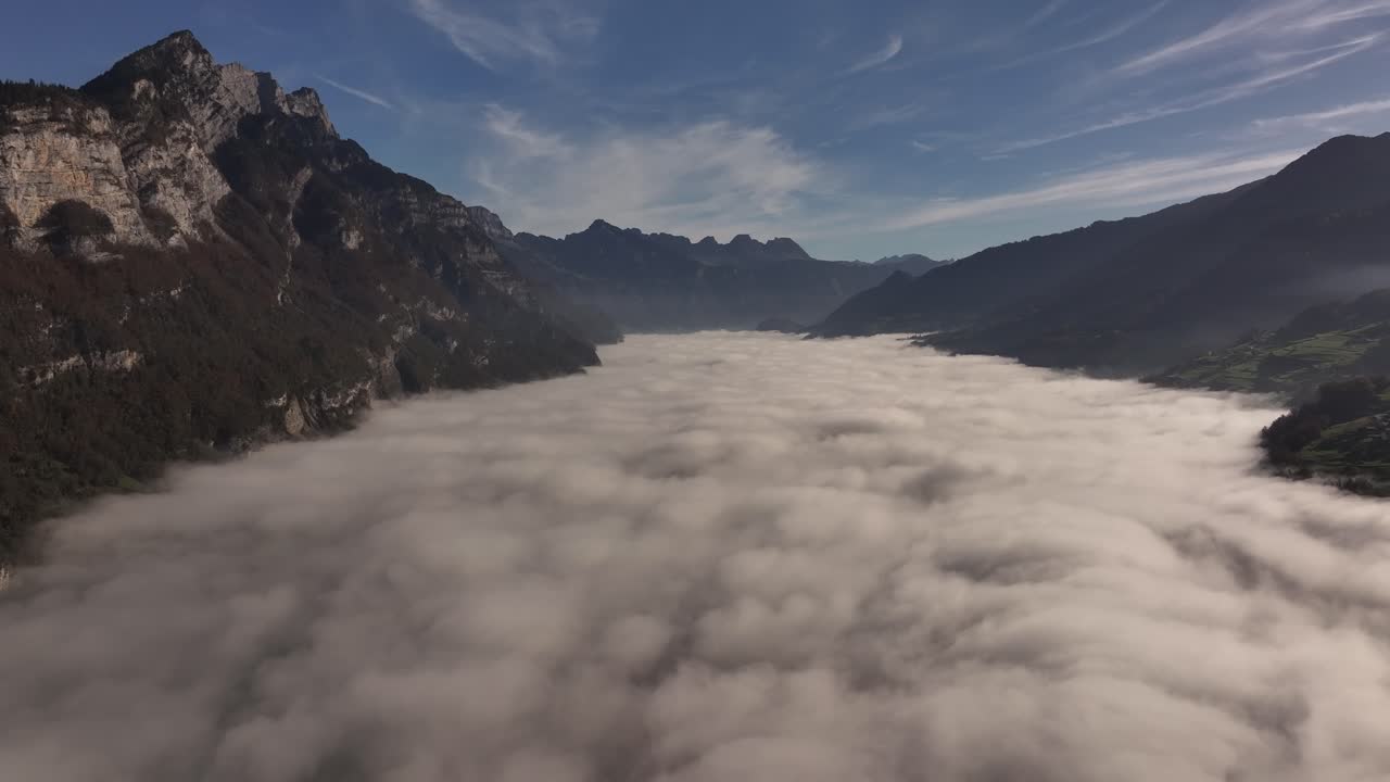 Aerial View of a Misty Valley in the Swiss Alps