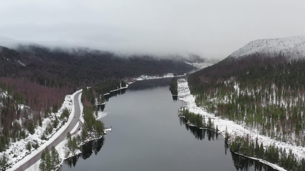 Hyperlapse of a manmade lake with a dam generating electricity in the winter of Sweden