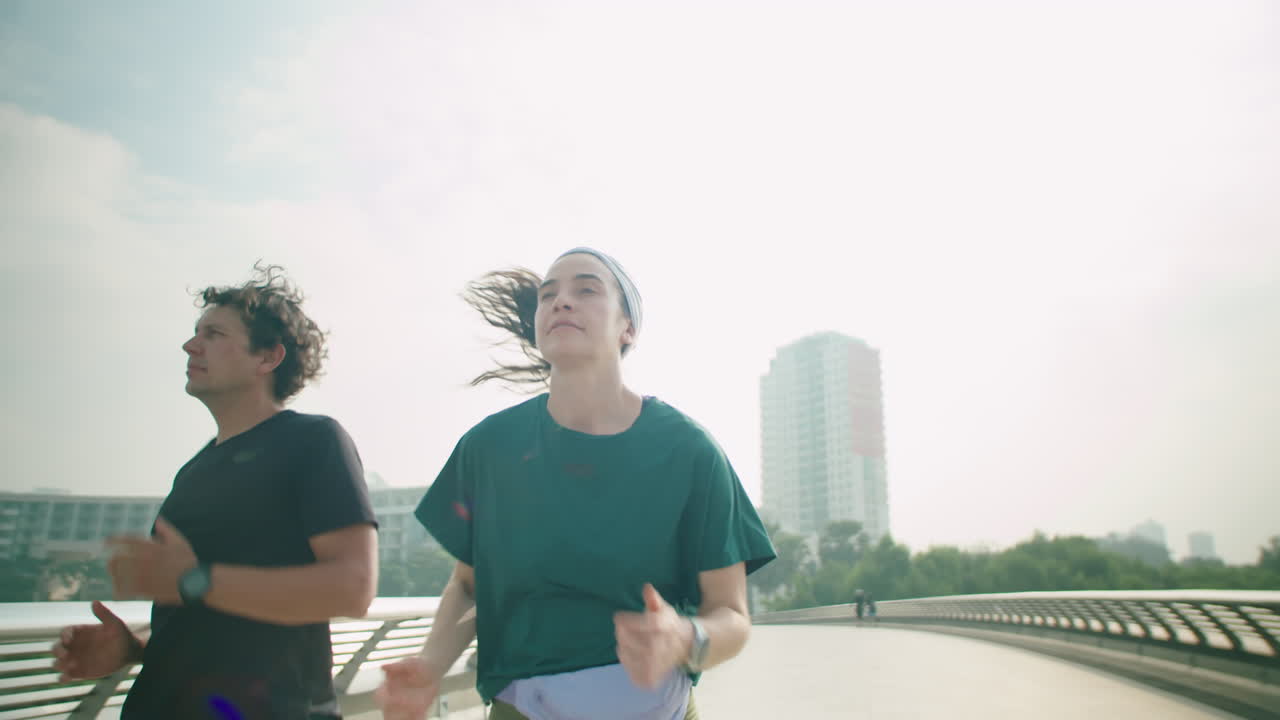 Sportive Couple Running Together in City