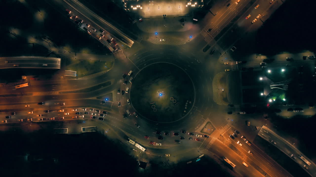 Aerial view round abound with traffic at night , Bucharest Romania