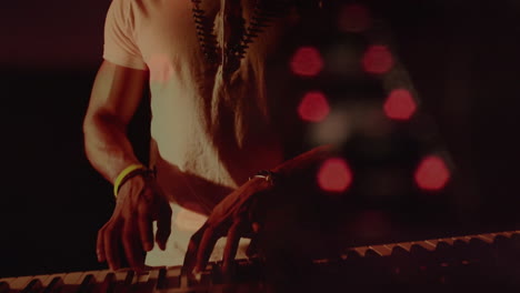 animation of blurred night road traffic over caucasian man playing keyboard on concert
