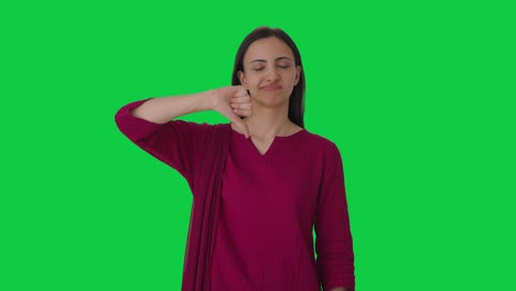 Upset-Indian-female-teacher-showing-thumbs-down-Green-screen