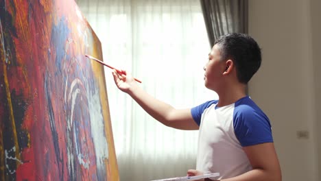boy painting abstract art